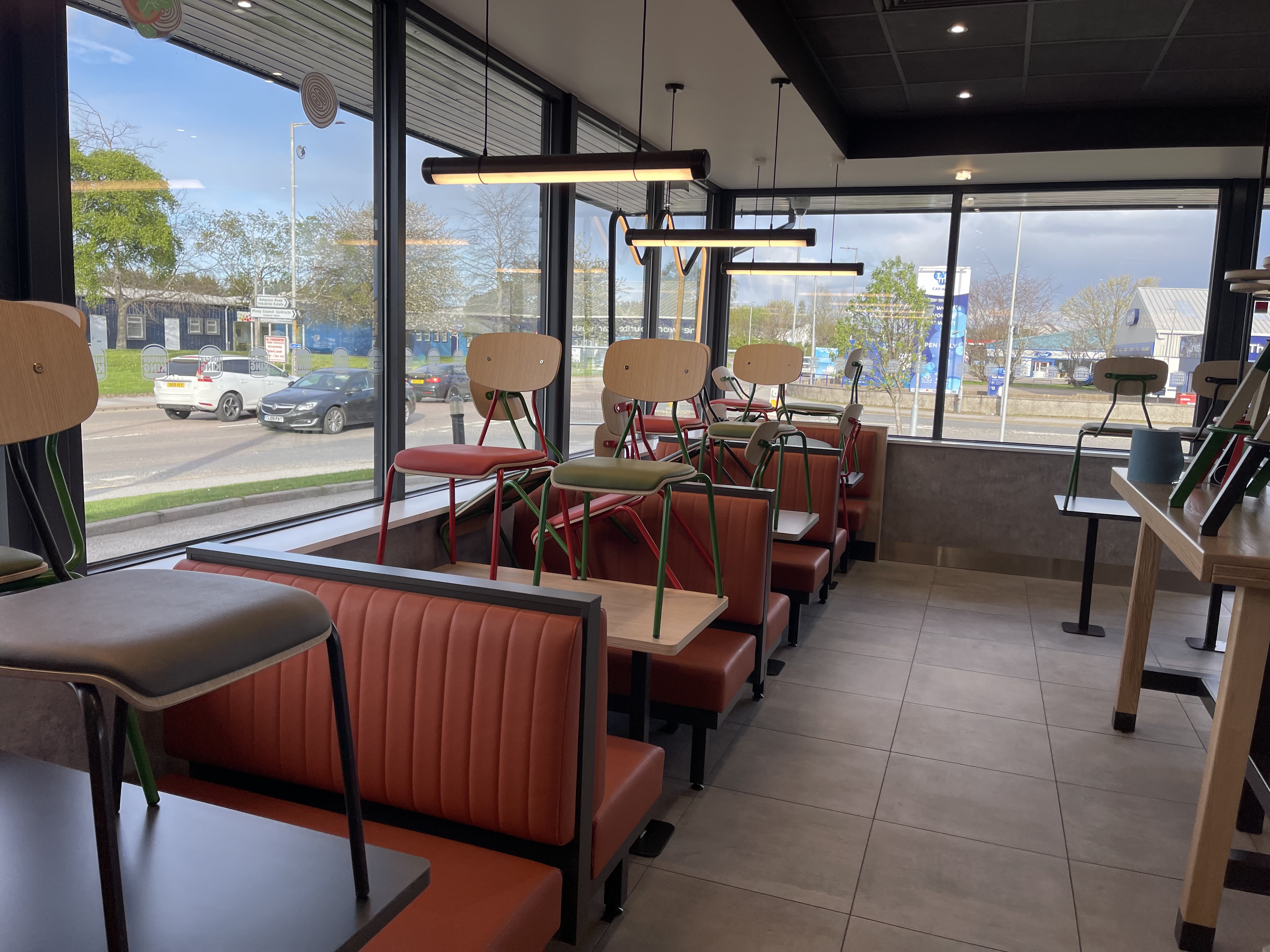 Restaurant seating area prepared for floor cleaning
