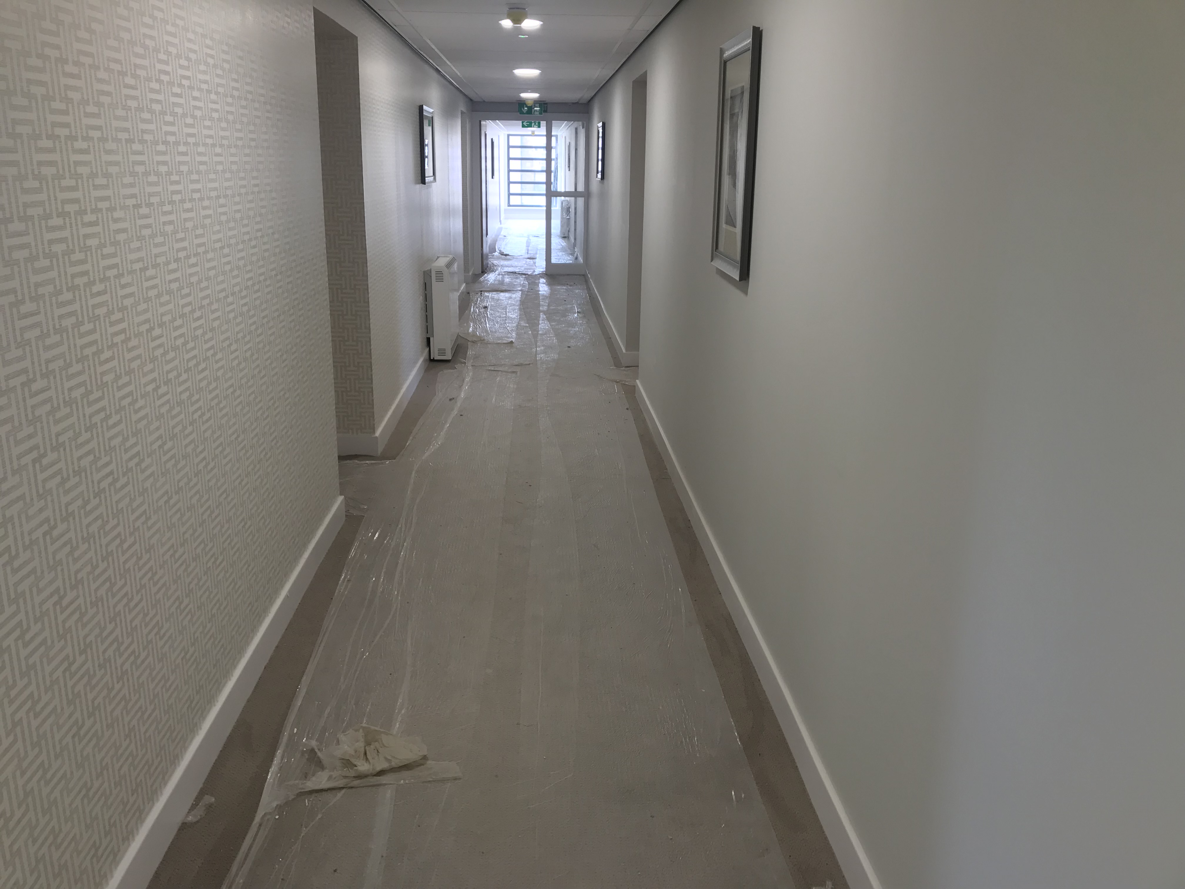 Protected corridor during commercial fit-out cleaning