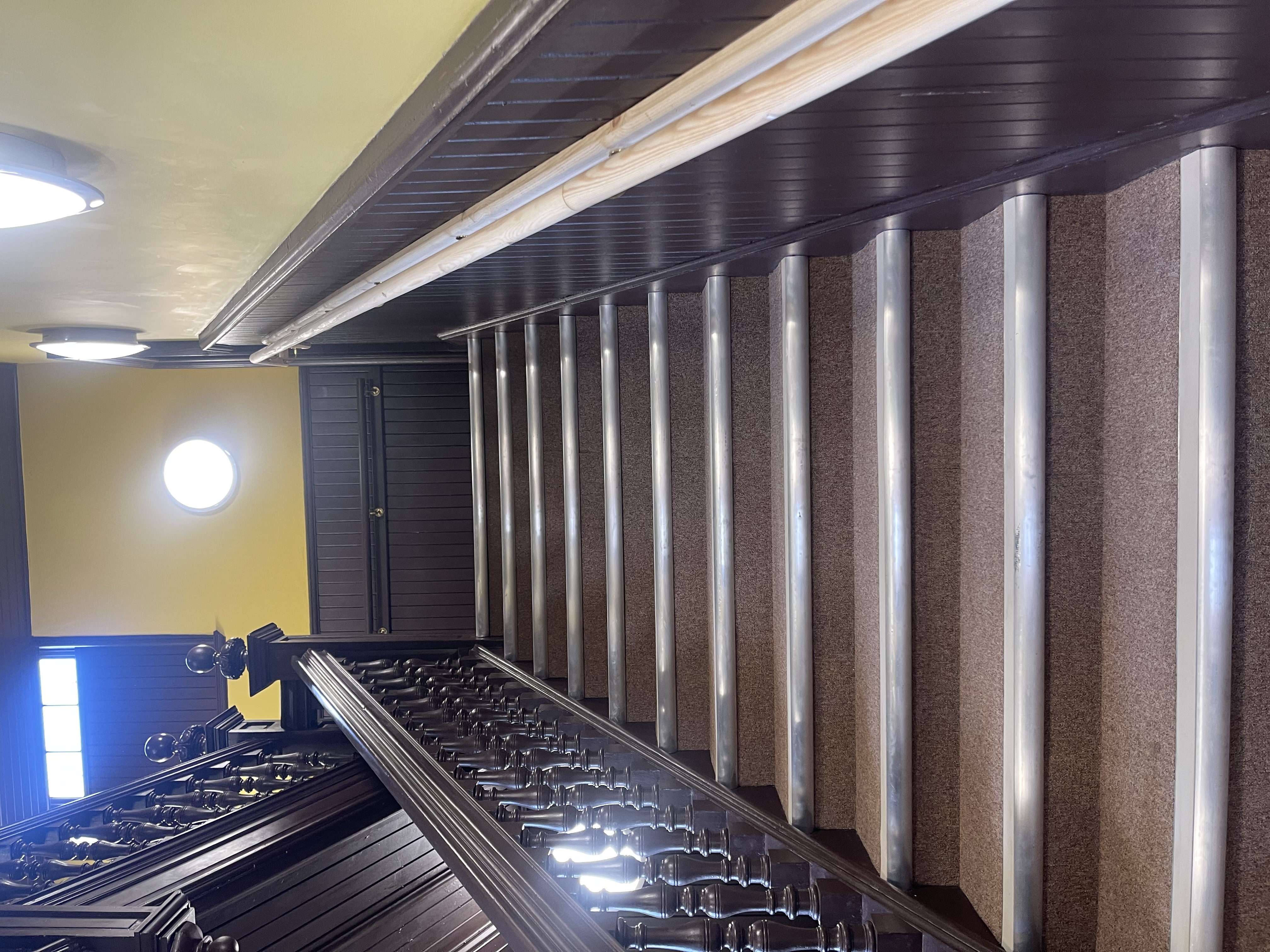 Clean heritage-style staircase inside a visitor venue